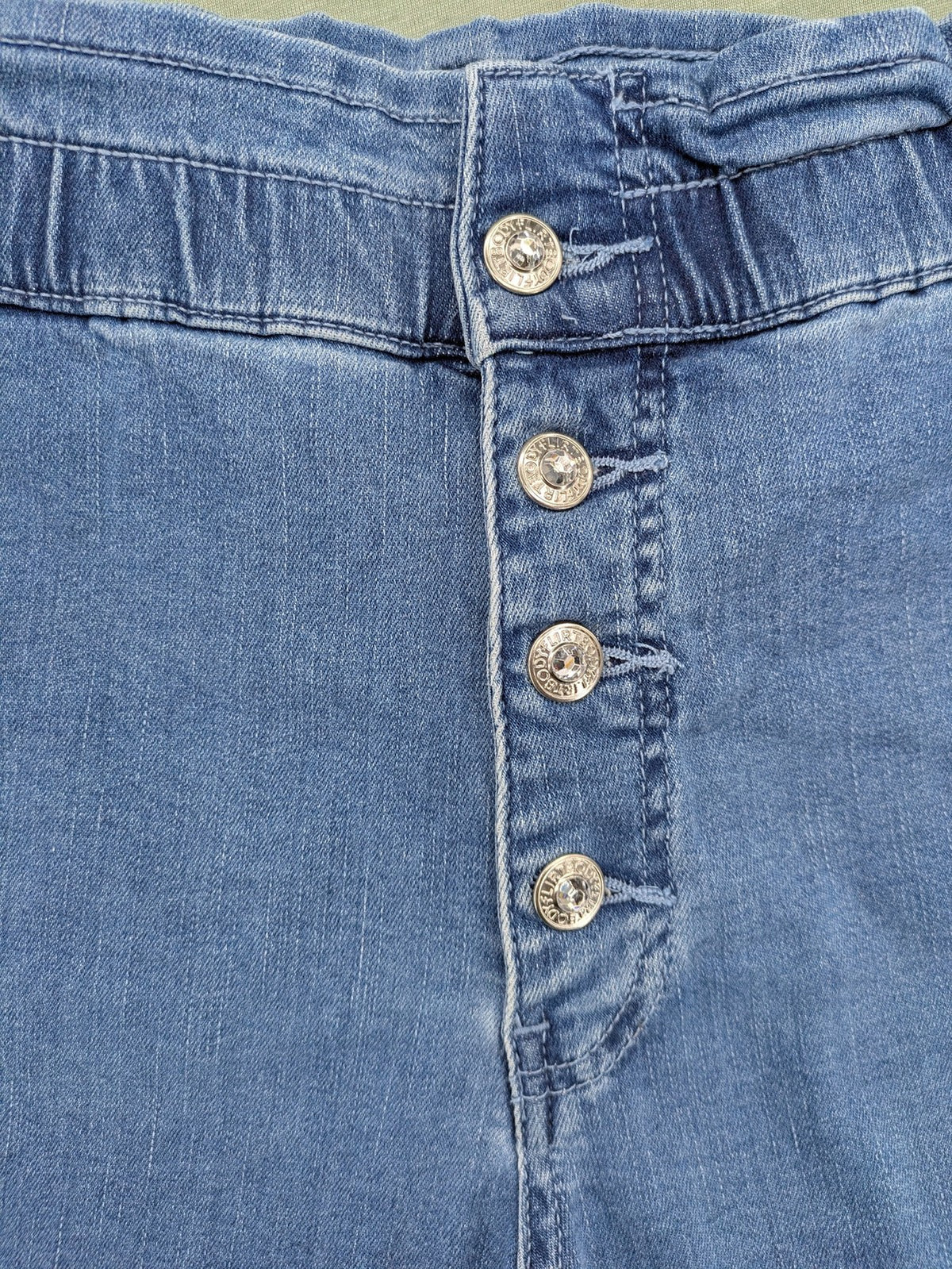 Bodyflirt blue high waist paperbag jeans shorts with button fly and rolled cuffs.