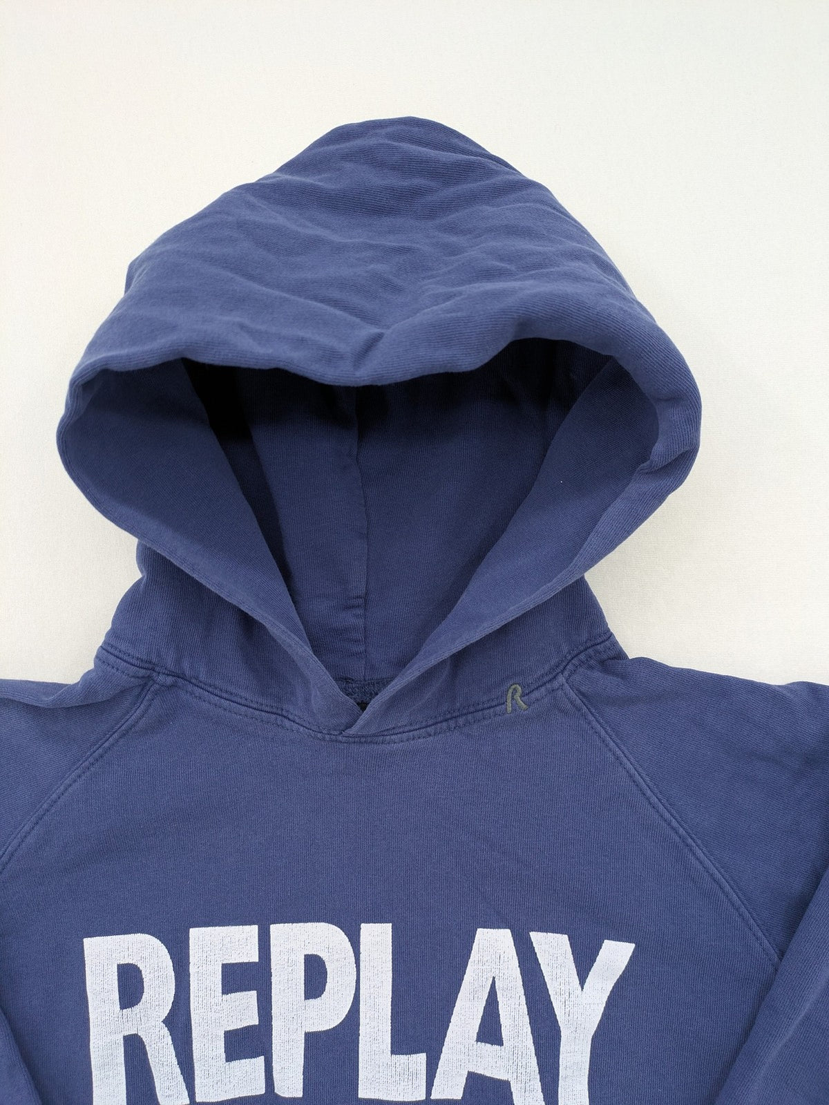 Replay blue turtle neck jumper with large logo print and kangaroo pocket, 100% cotton.