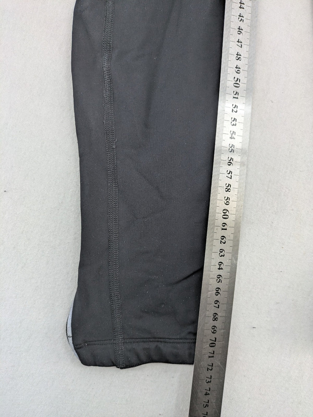 GORE RUNNING WEAR black bicycle tights with reflective details and zippered ankle openings.