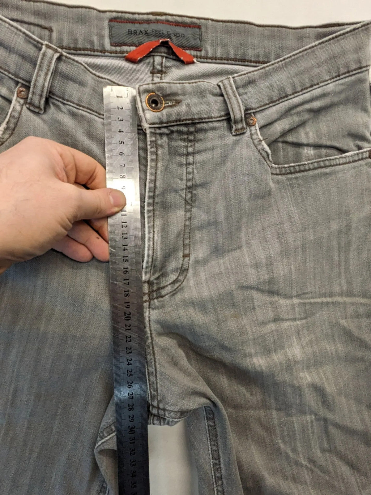 BRAX grey straight jeans with classic 5-pocket style and washed denim finish.