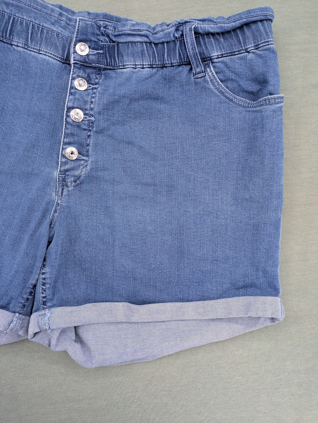 Bodyflirt blue high waist paperbag jeans shorts with button fly and rolled cuffs.