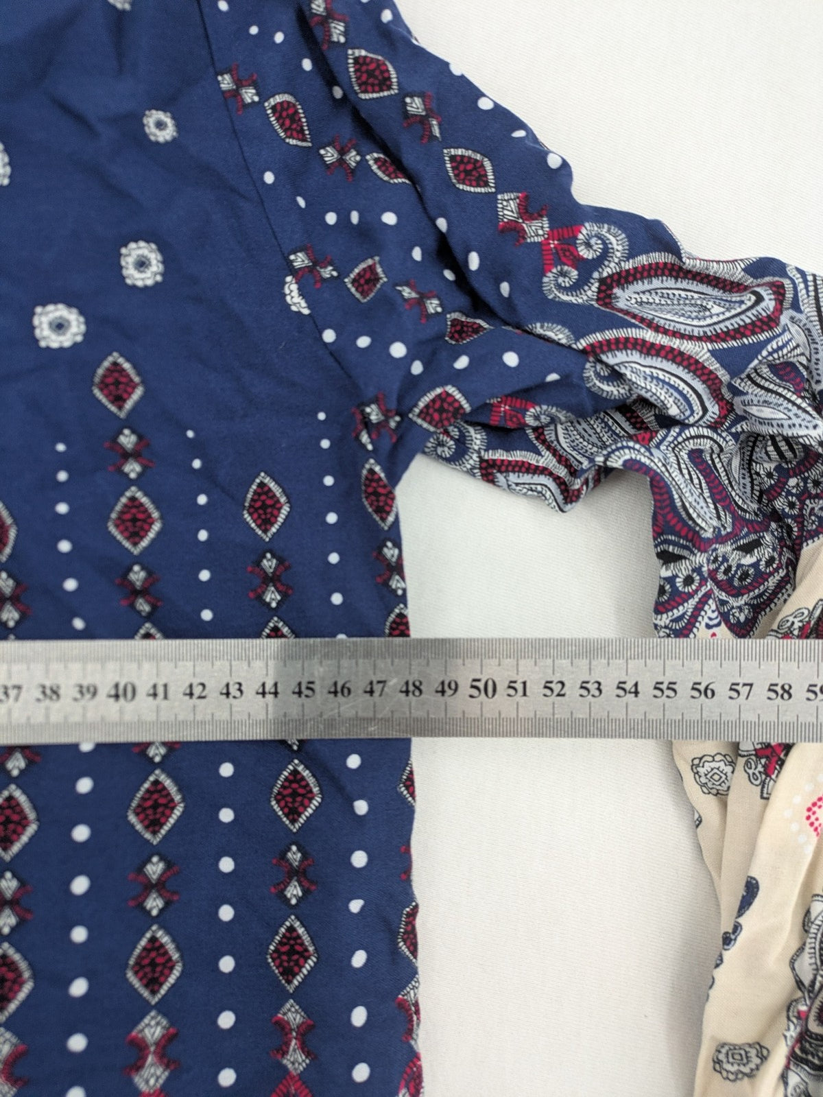 Uğurlar Collection multi tunic dress with vibrant Boho-Ethno pattern and V-neck tassel detail.