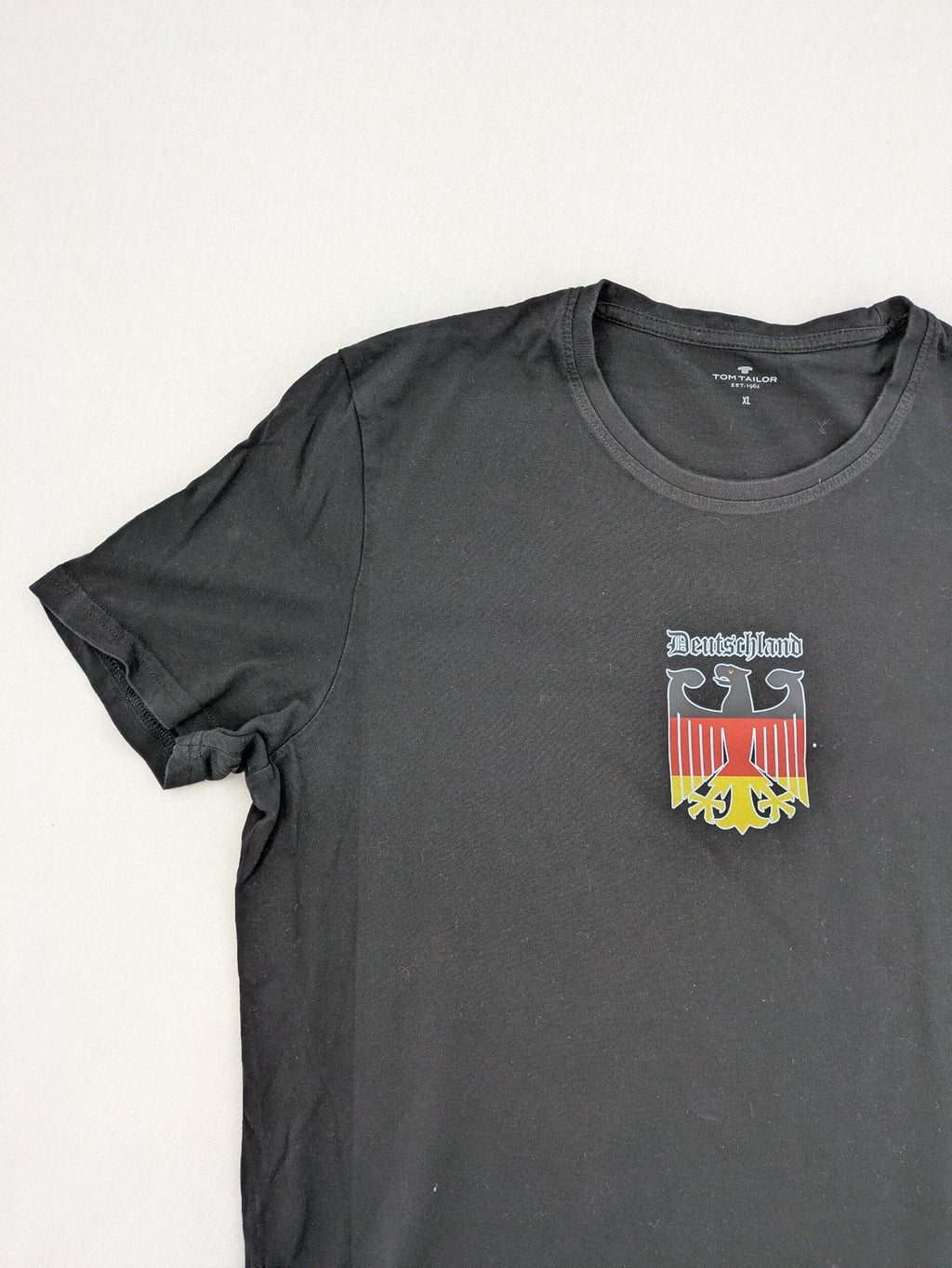 Tom Tailor black T-shirt with Germany eagle crest and flag colors, 100% cotton.
