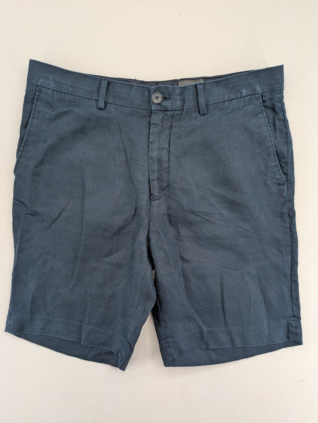 H&M blue linen shorts size 50 flat front design with practical pockets.