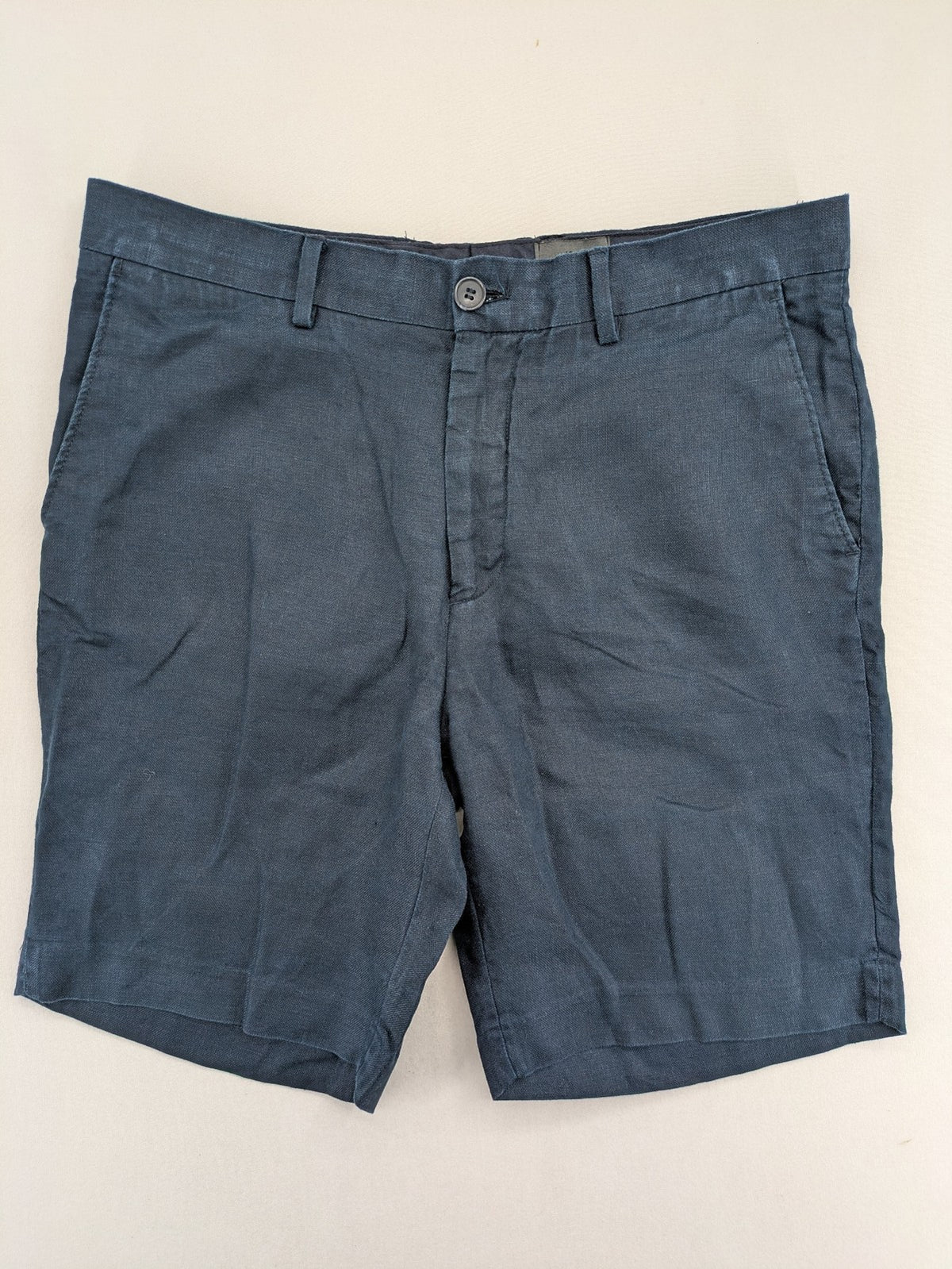 H&M blue linen shorts size 50 flat front design with practical pockets.