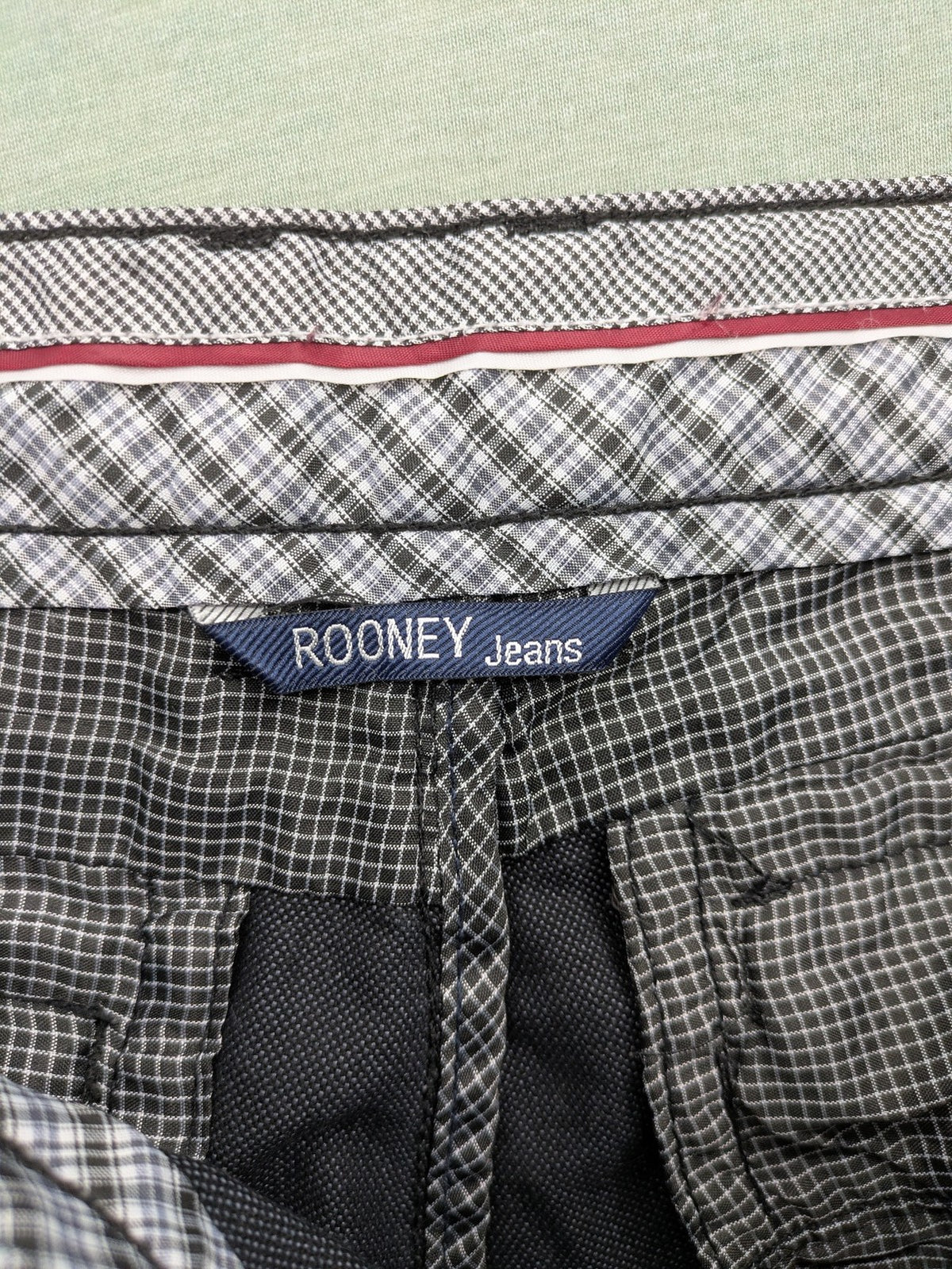 Rooney grey chino pants with checkered waistband and buttoned back pockets.