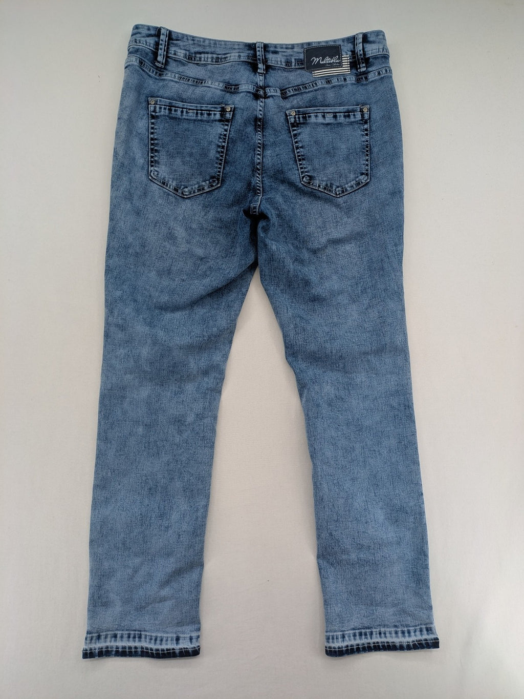Multiblu blue straight jeans slim fit with decorative front zippers and light wash.