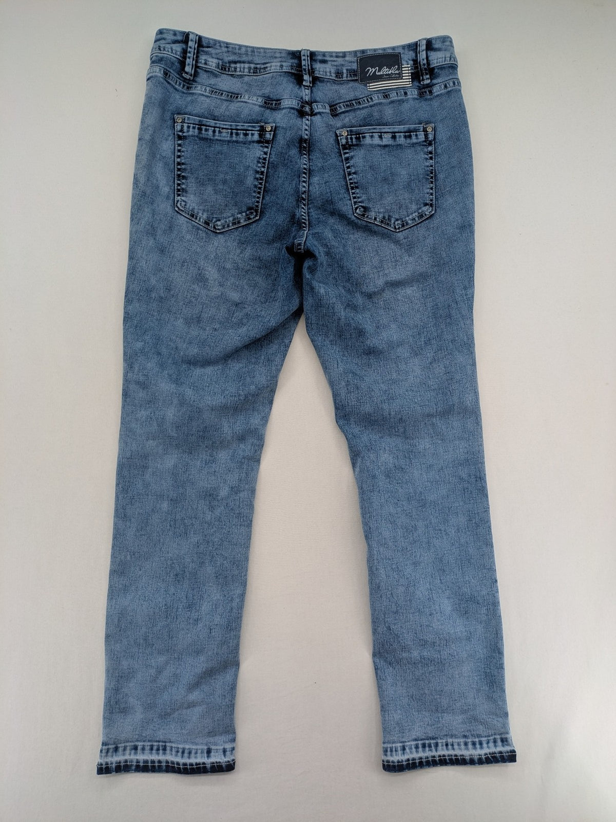 Multiblu blue straight jeans slim fit with decorative front zippers and light wash.