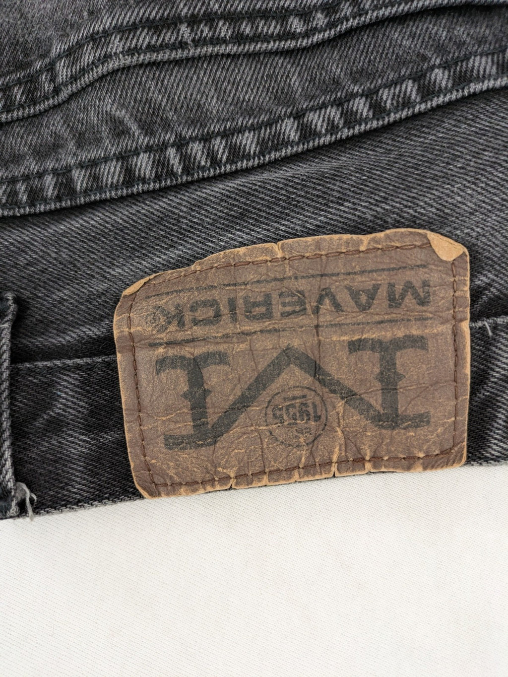 Maverick black straight jeans faded wash with iconic logo on back patch.
