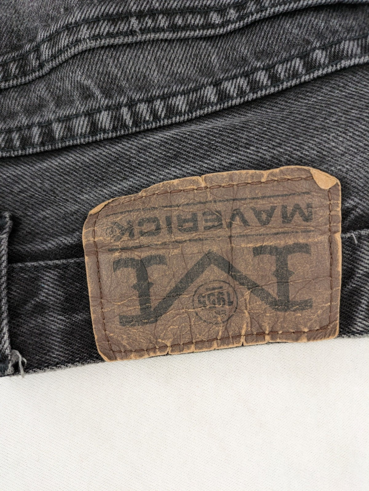Maverick black straight jeans faded wash with iconic logo on back patch.