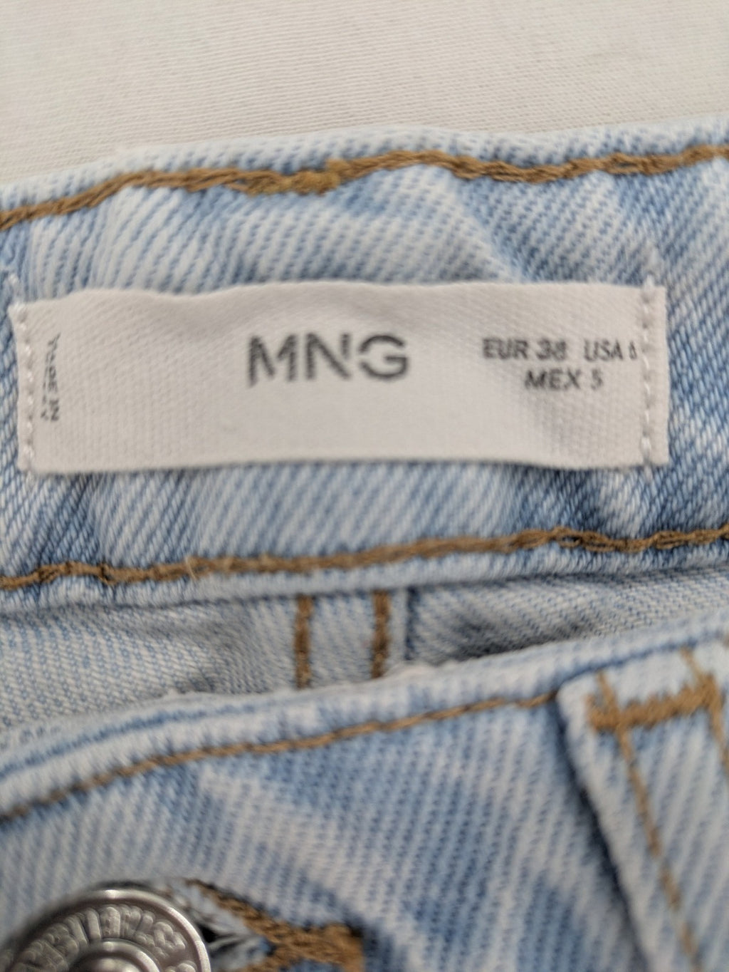 MNG blue high waist mom jeans with raw hem and five-pocket style.