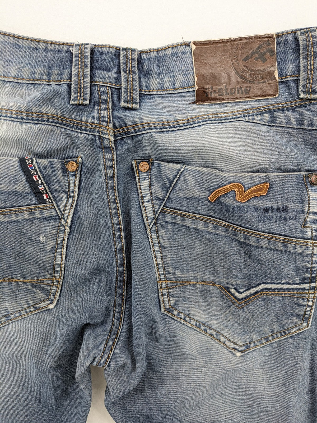 R-Stone Jeans blue straight leg denim with washed effect and "Fashion Wear" embroidery.