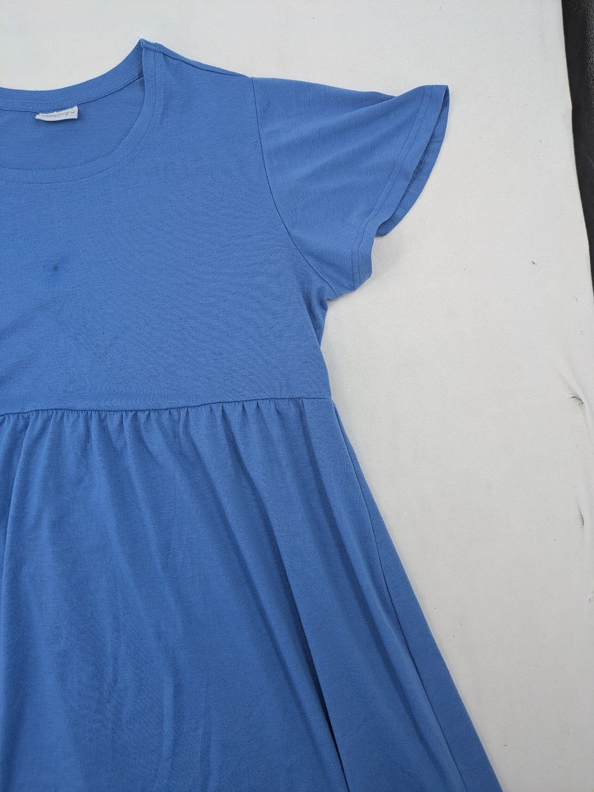 Infinity blue T-shirt dress A-line cut with playful flutter sleeves and soft stretch fabric.