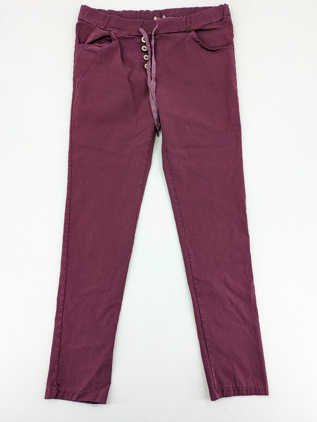 Pink Cherry pants pink stretchy fabric with decorative buttons and elastic waistband.