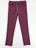 Pink Cherry pants pink stretchy fabric with decorative buttons and elastic waistband.