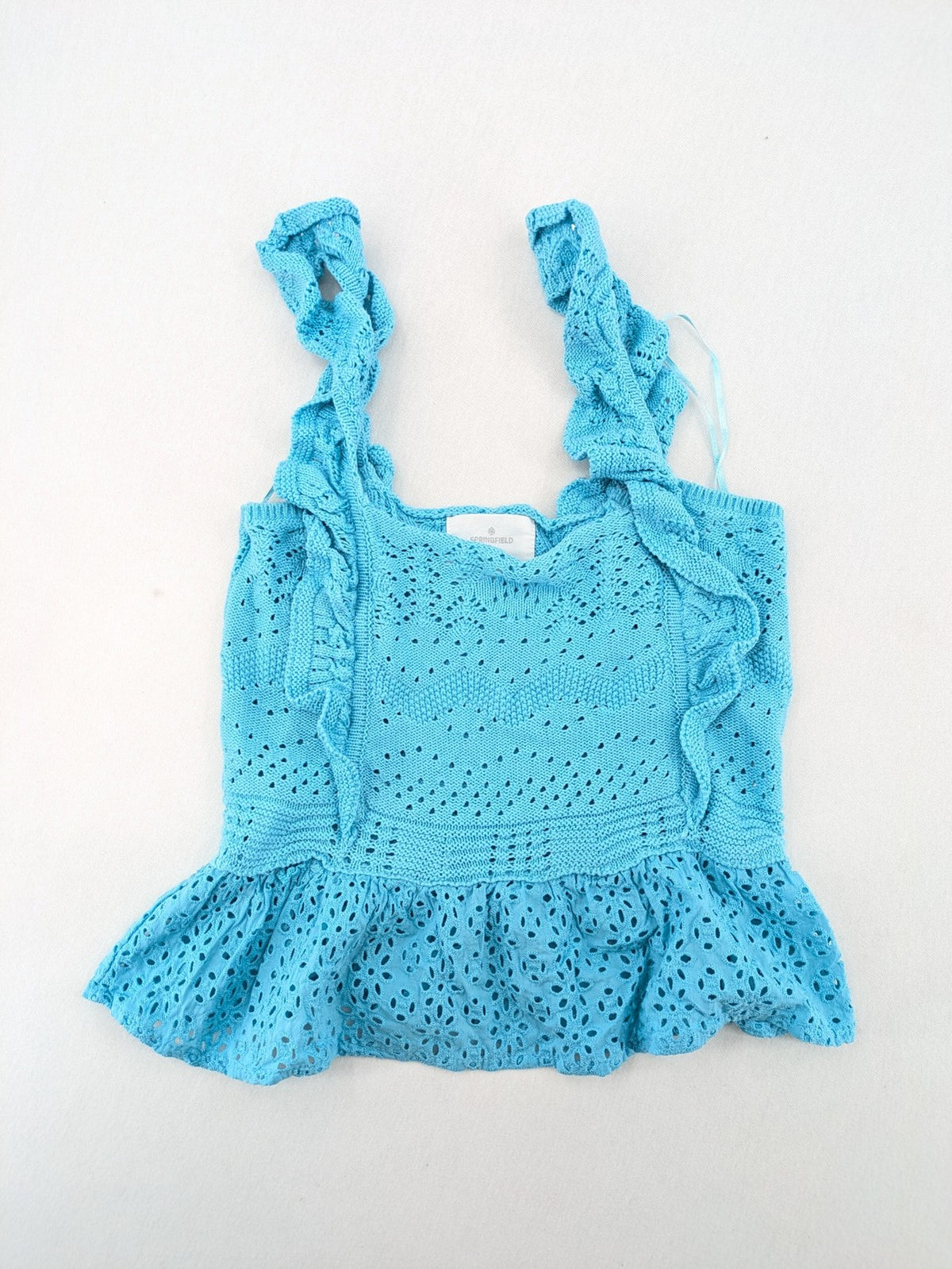 Springfield blue knit top with ruffled straps, peplum hem, and lace embroidery.