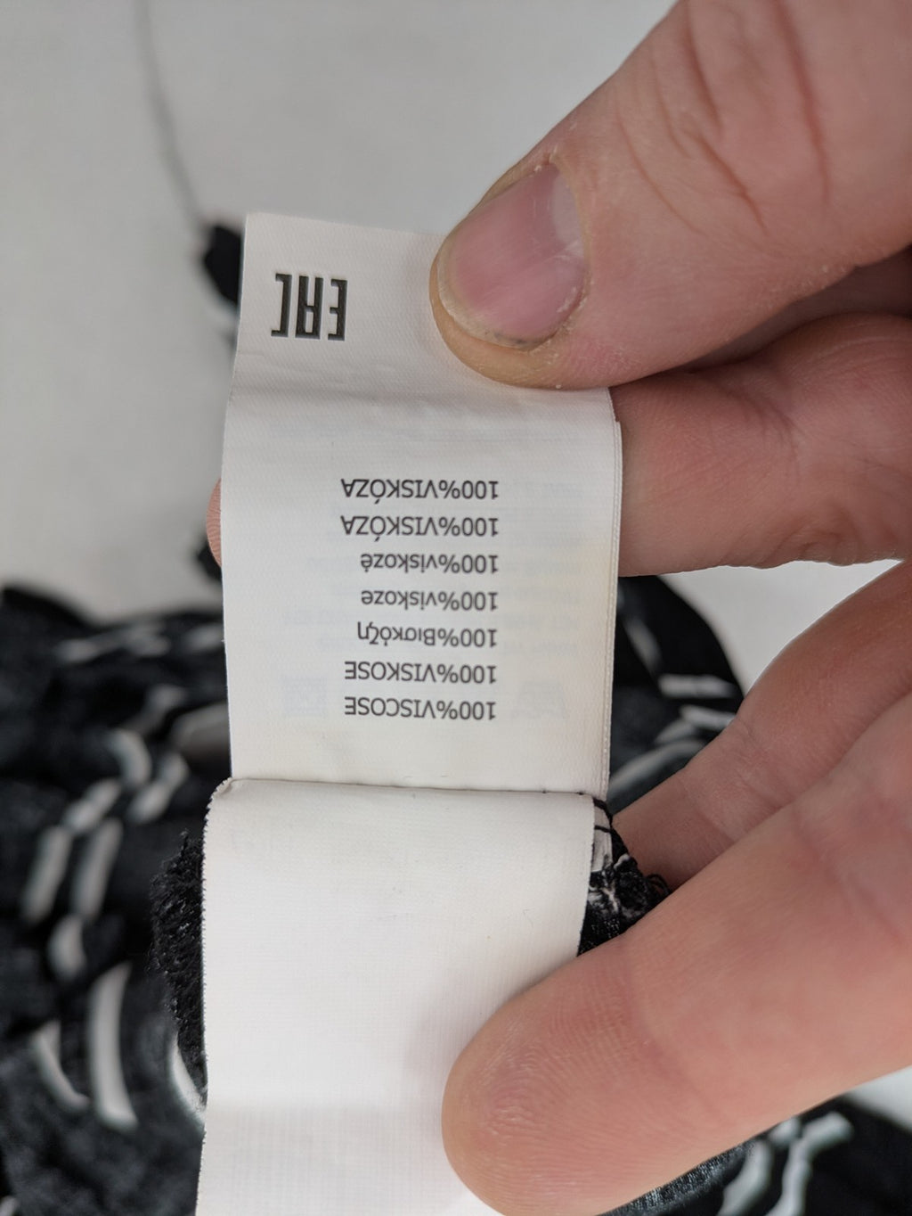 Hailys black and white striped crop top with front tie and off-shoulder design.