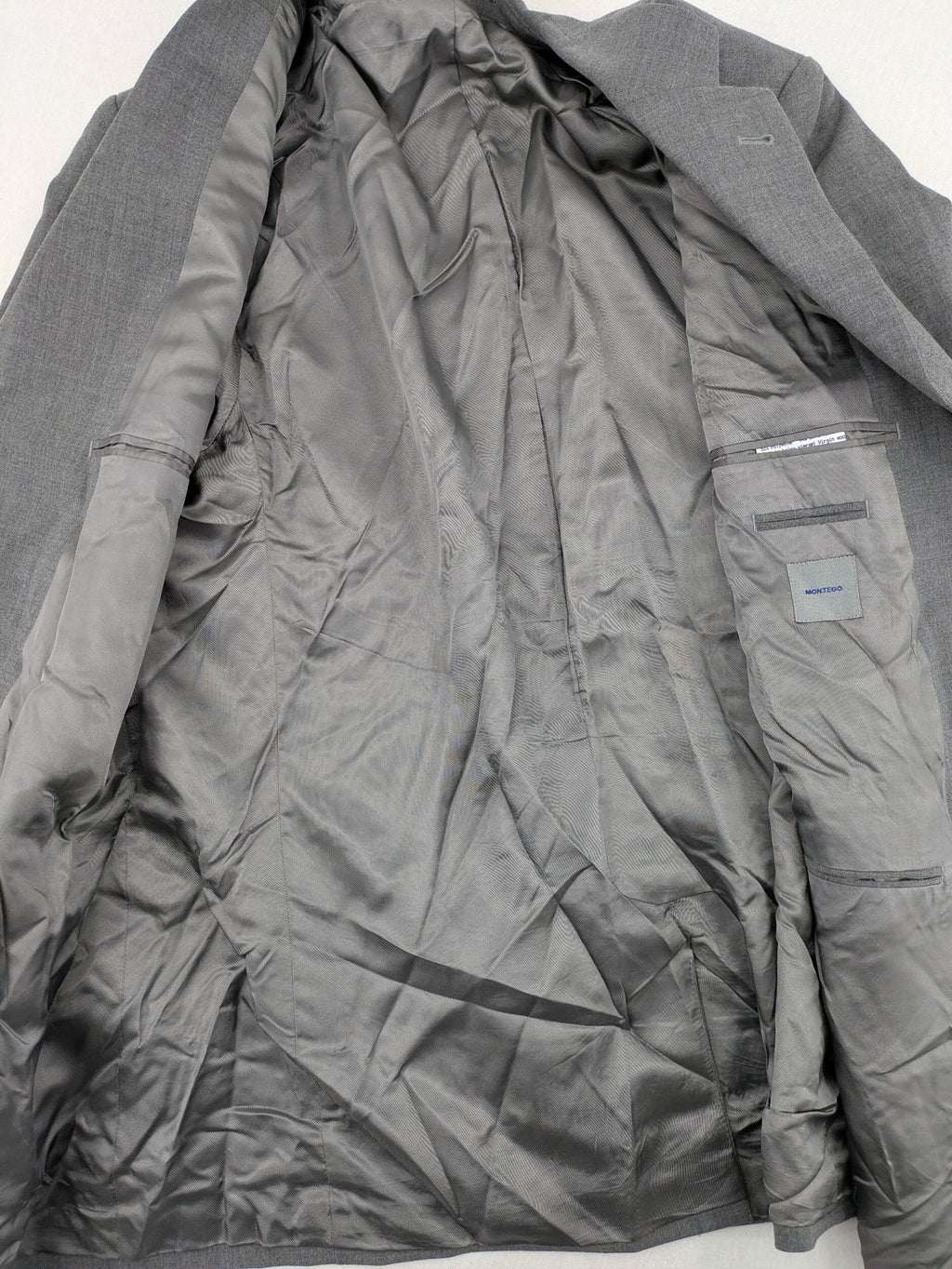 Montego grey blazer three-button design made from wool blend with smooth lining.