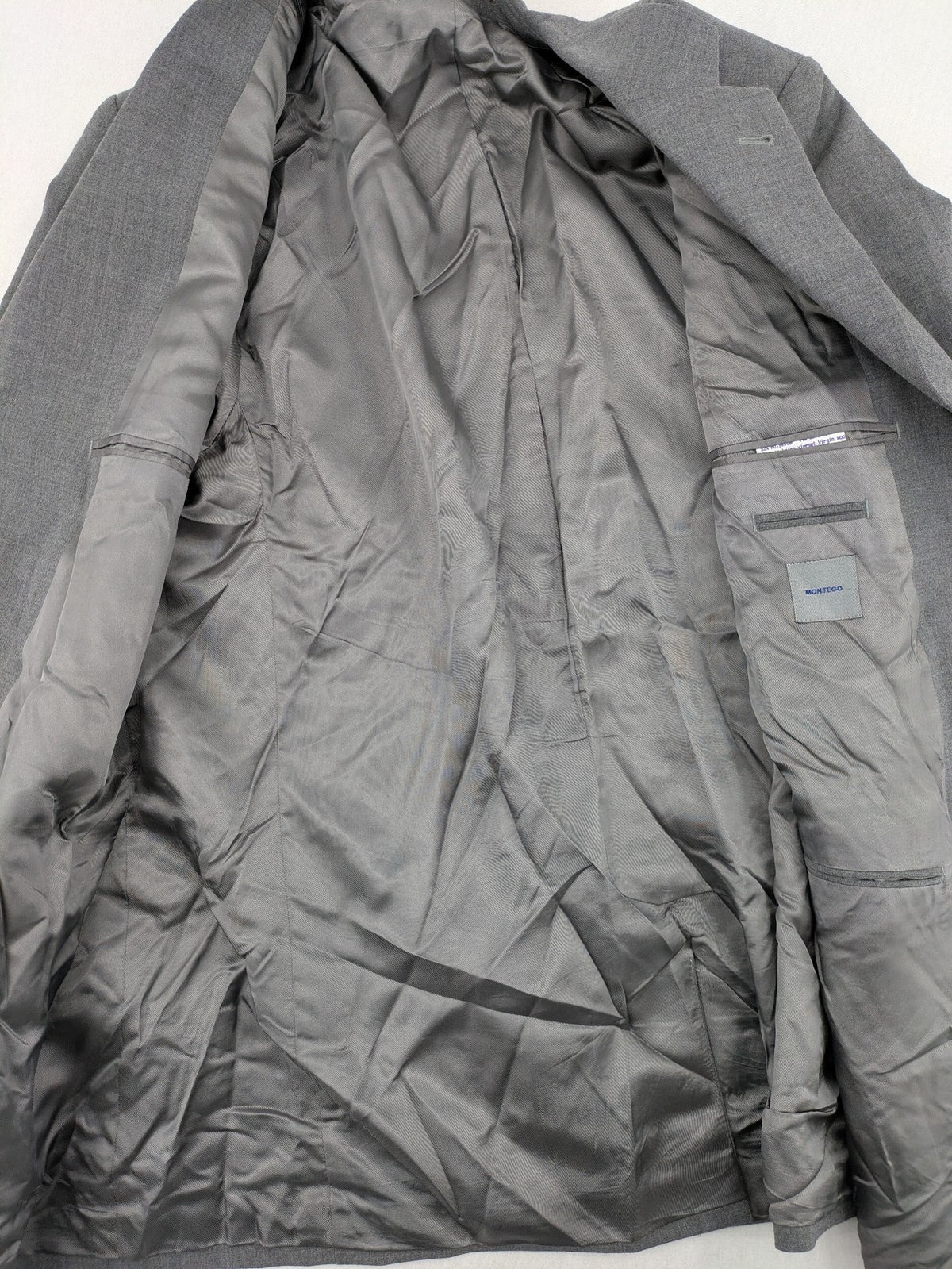Montego grey blazer three-button design made from wool blend with smooth lining.
