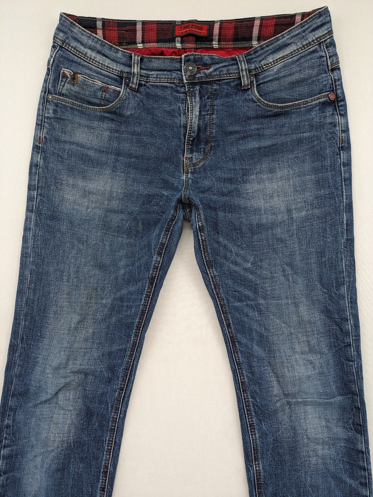 Timezone blue straight jeans slim fit with checkered pattern lining and button fly.