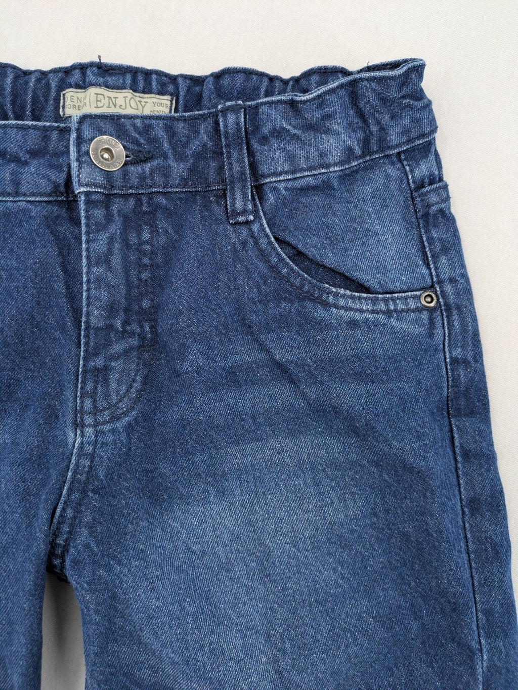 Pocopiano blue denim shorts with rolled cuffs and elastic waistband for comfort.