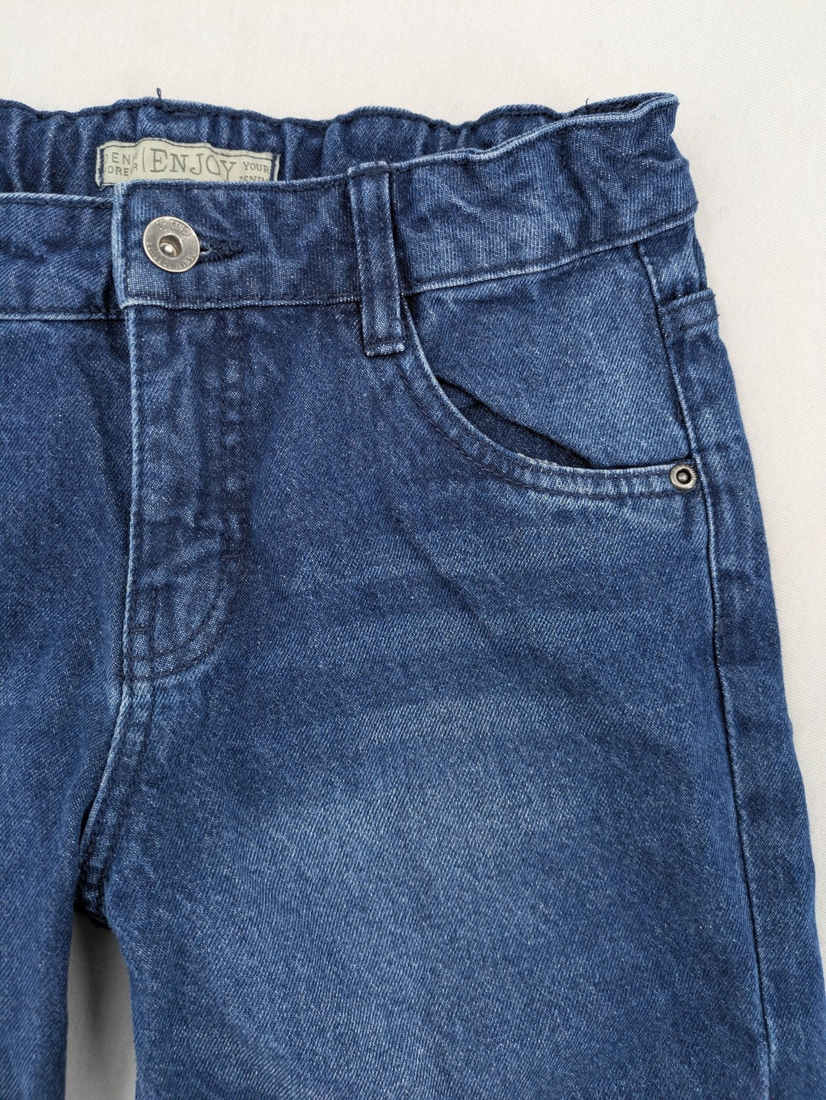 Pocopiano blue denim shorts with rolled cuffs and elastic waistband for comfort.