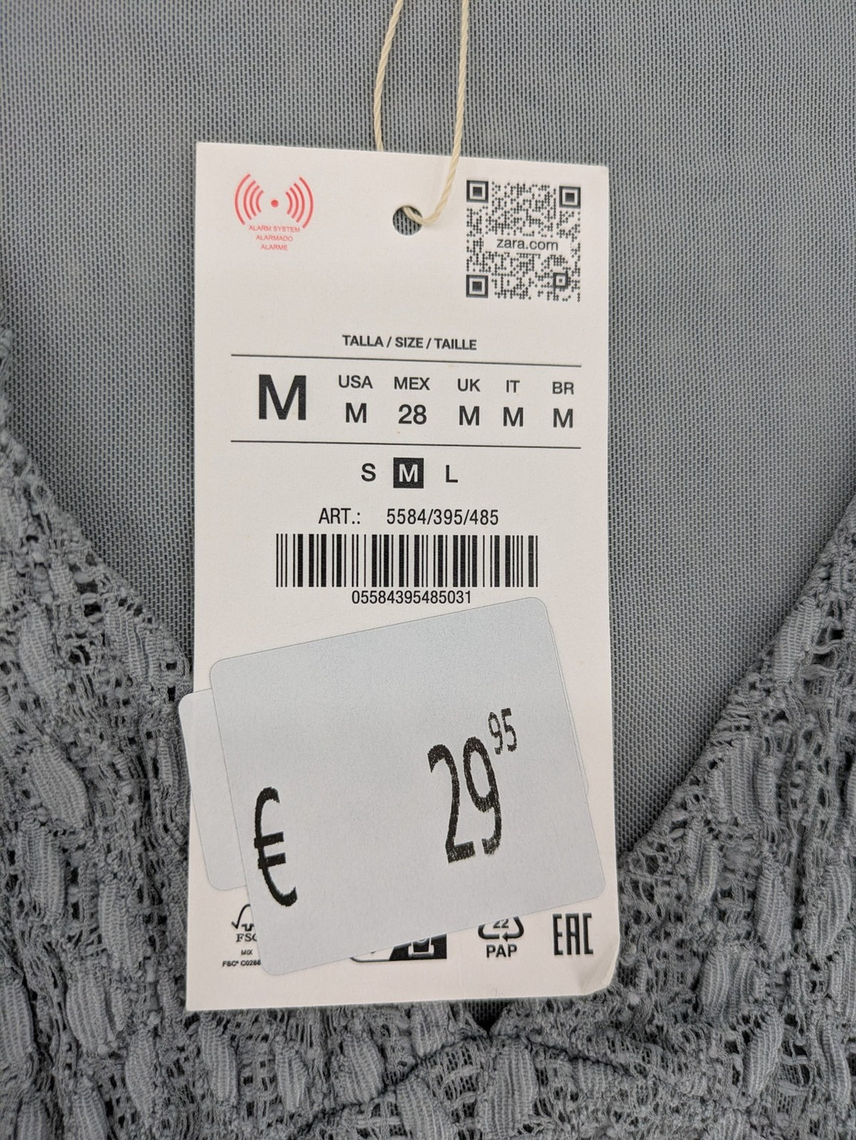 Zara grey mini dress with V-neck, puff sleeves, and textured fabric pattern.