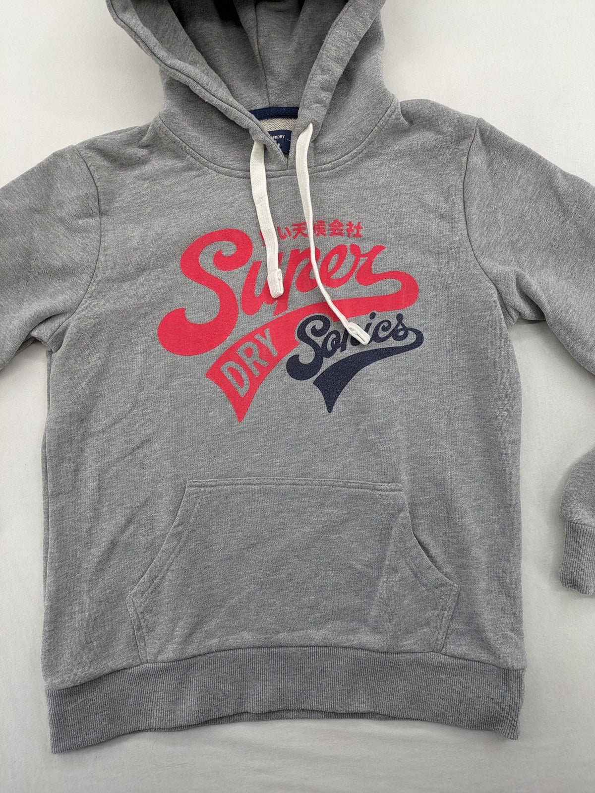 Superdry grey hoodie with Sonics logo, number 7 detail, kangaroo pocket, and drawstring hood.