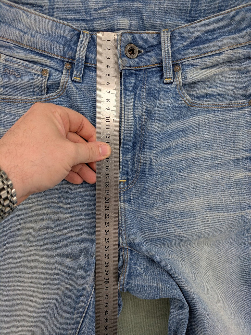 G-Star Raw blue slim skinny jeans with light wash and signature back zip pocket.