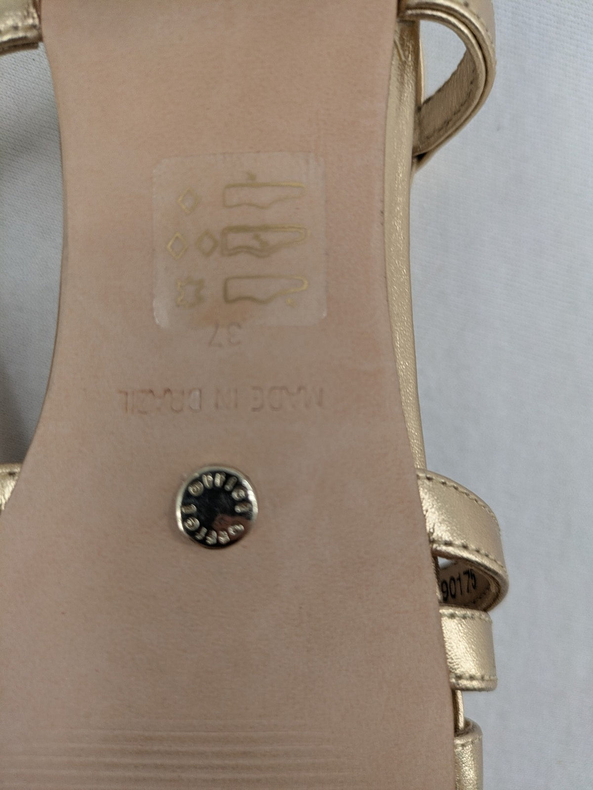 Office London gold metallic sandals with adjustable ankle strap and block heel design.