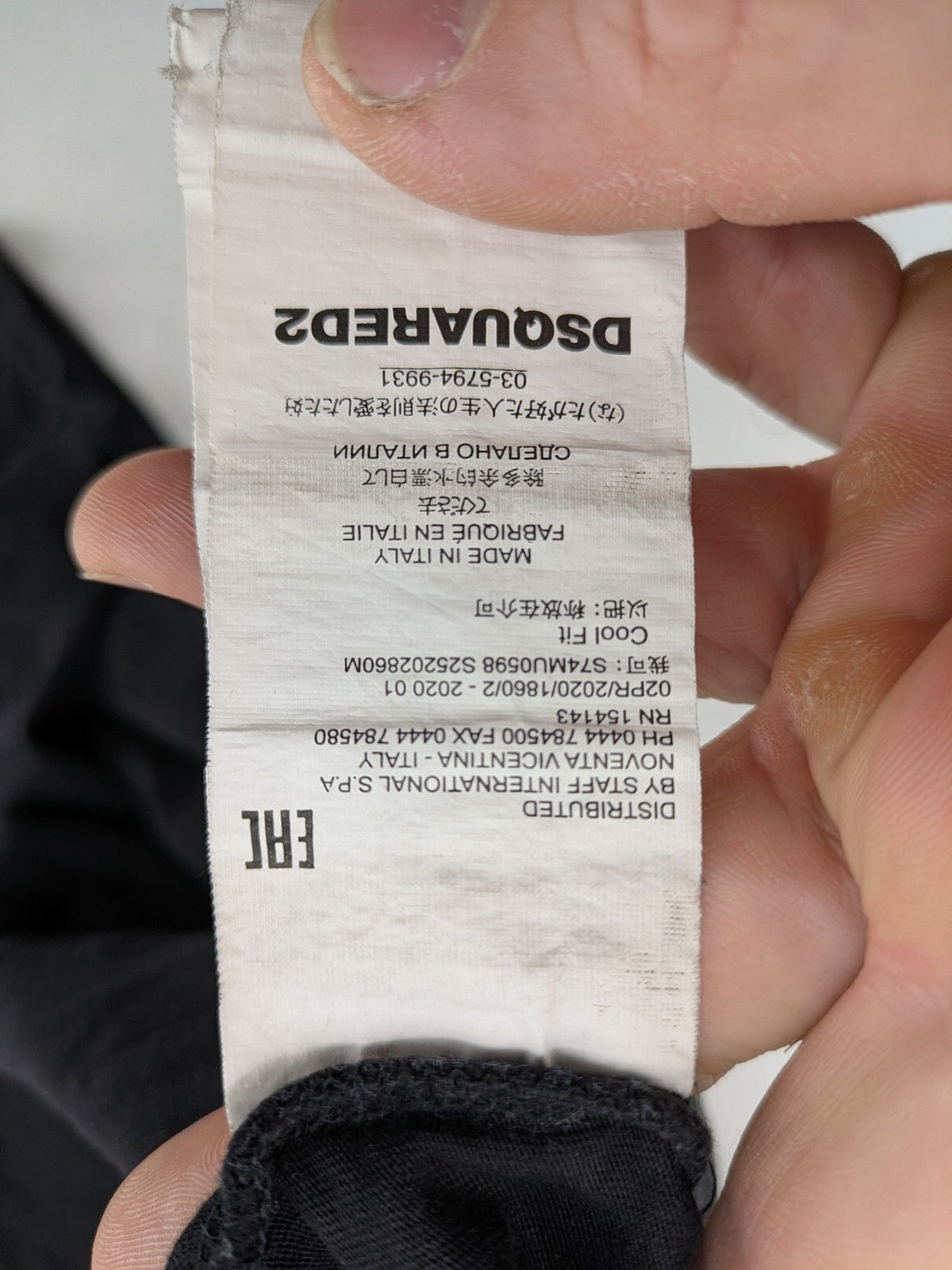 Dsquared2 grey short sleeve shirt with red maple leaf and smiley face graphic.