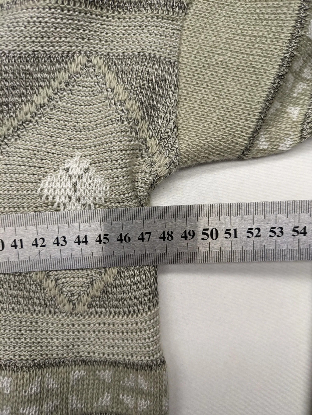 Lewträger cream and grey turtle neck jumper with geometric pattern and button placket.