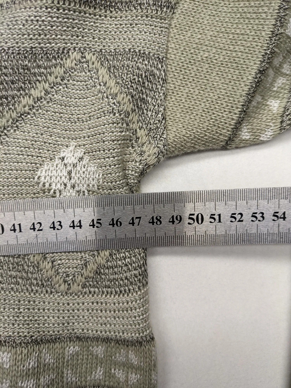 Lewträger cream and grey turtle neck jumper with geometric pattern and button placket.