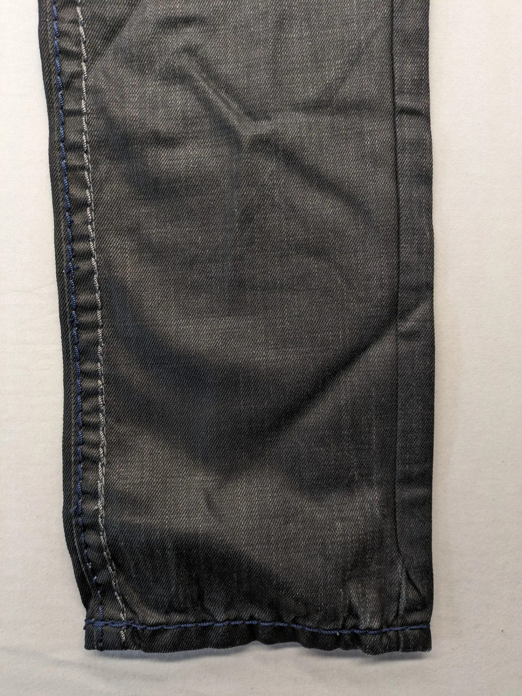 Fadnoble grey straight jeans with button fly and contrasting stitching details.