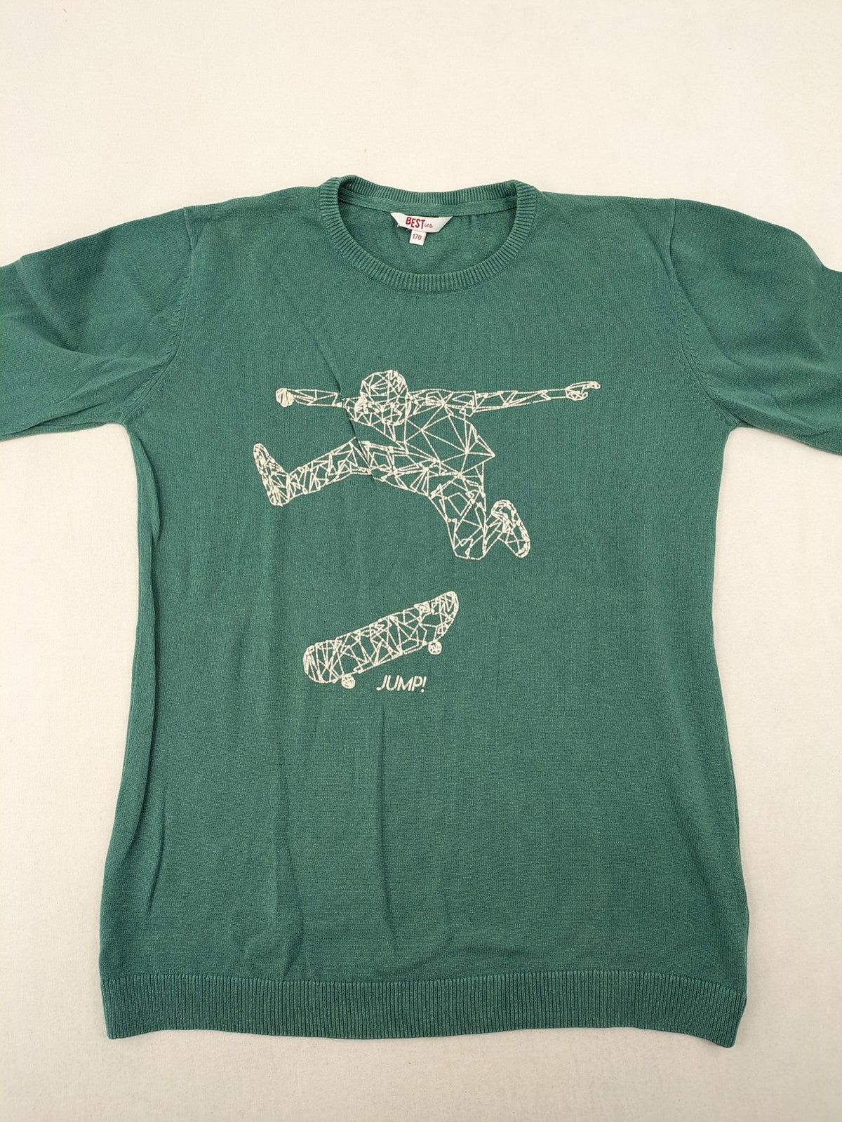 BESTies green turtle neck jumper with white skateboard graphic and ribbed cuffs.