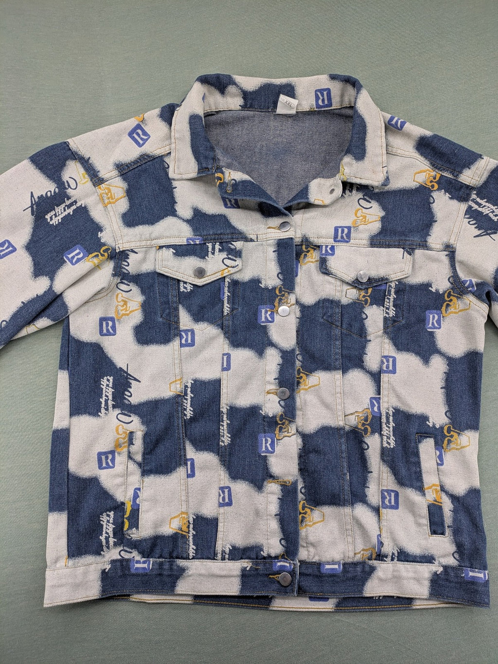 XXL blue and white graphic jacket with allover print and classic trucker style.