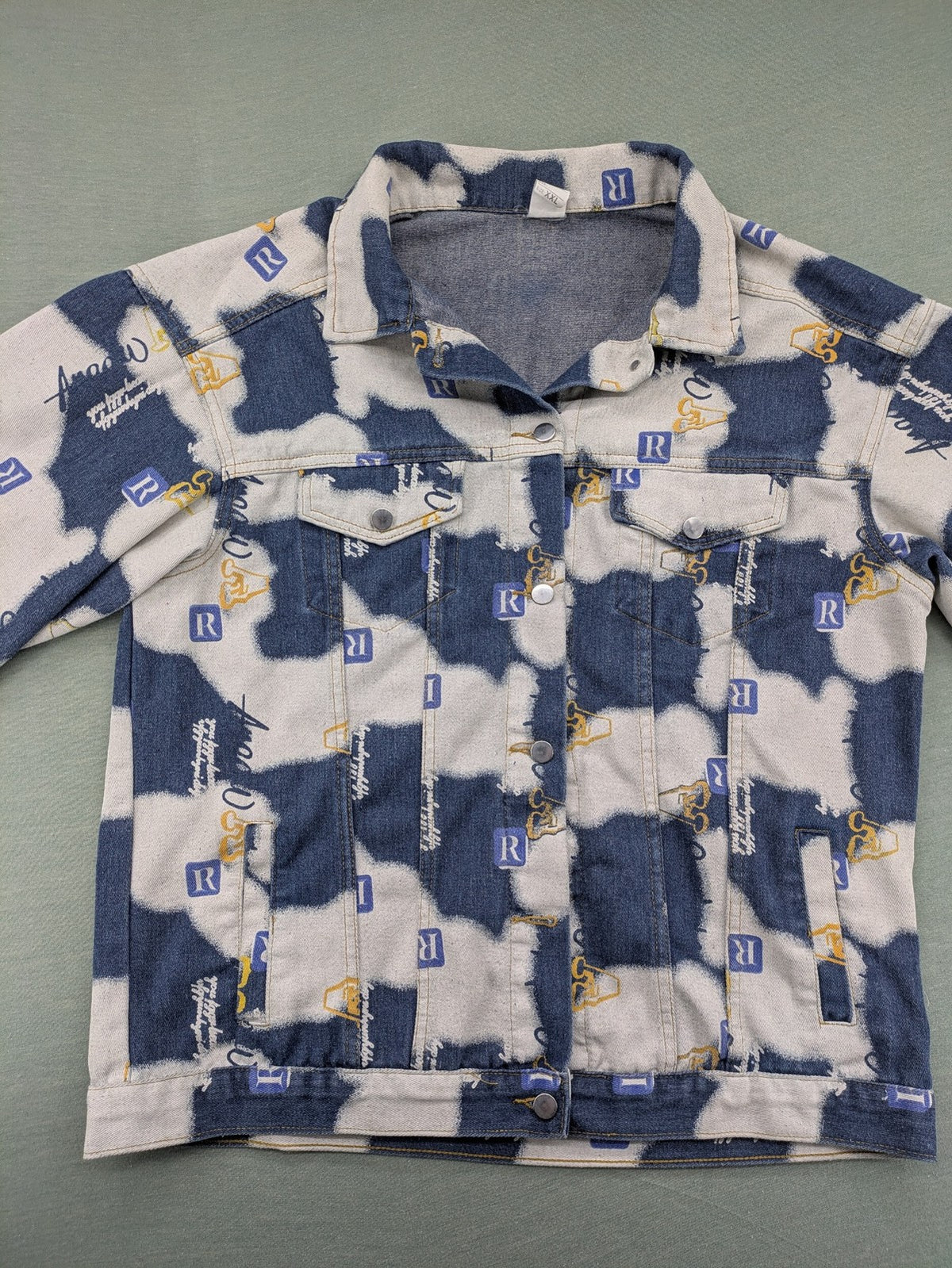XXL blue and white graphic jacket with allover print and classic trucker style.