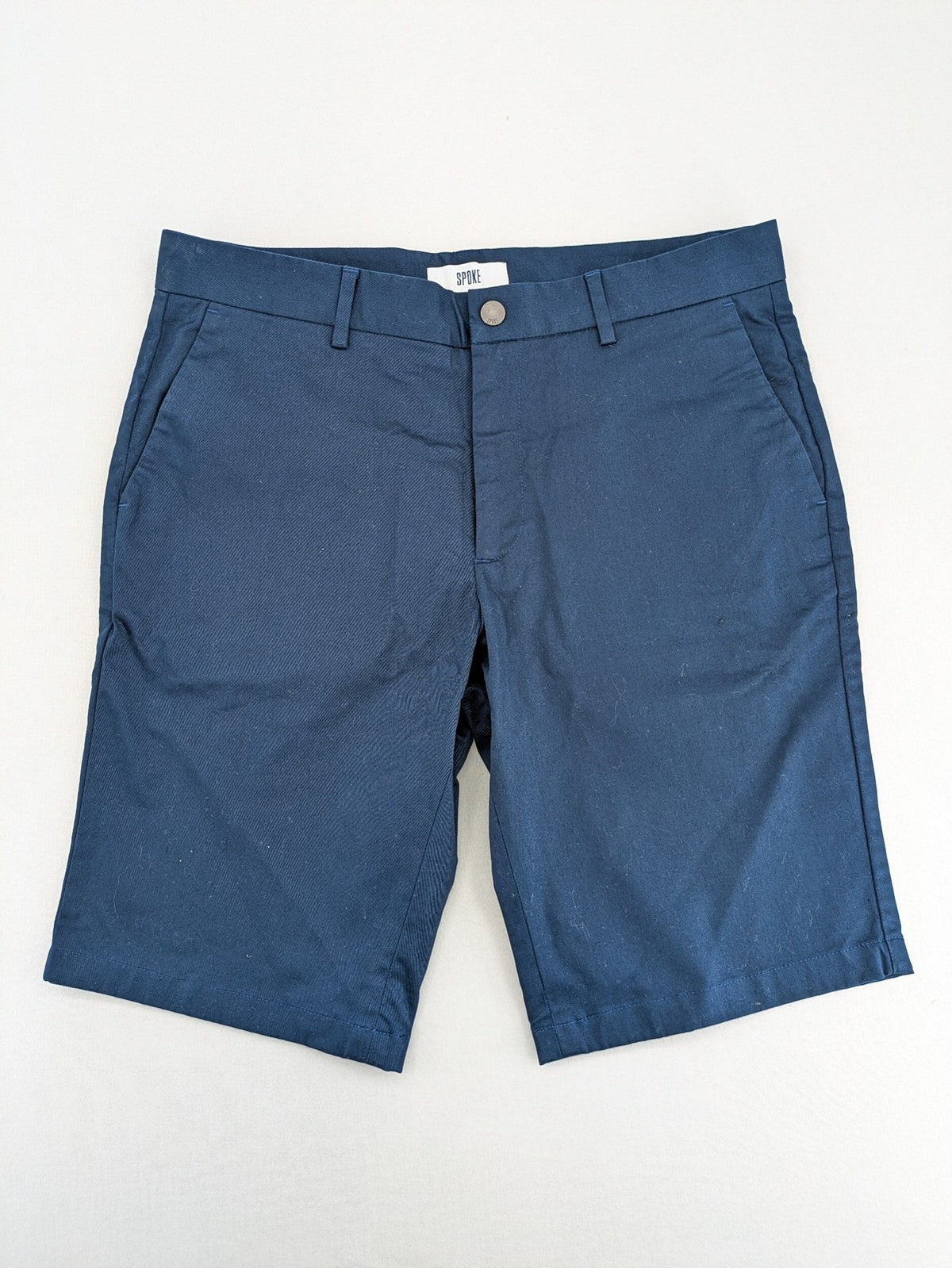 Spoke navy chino shorts flat front with unique printed pocket lining.
