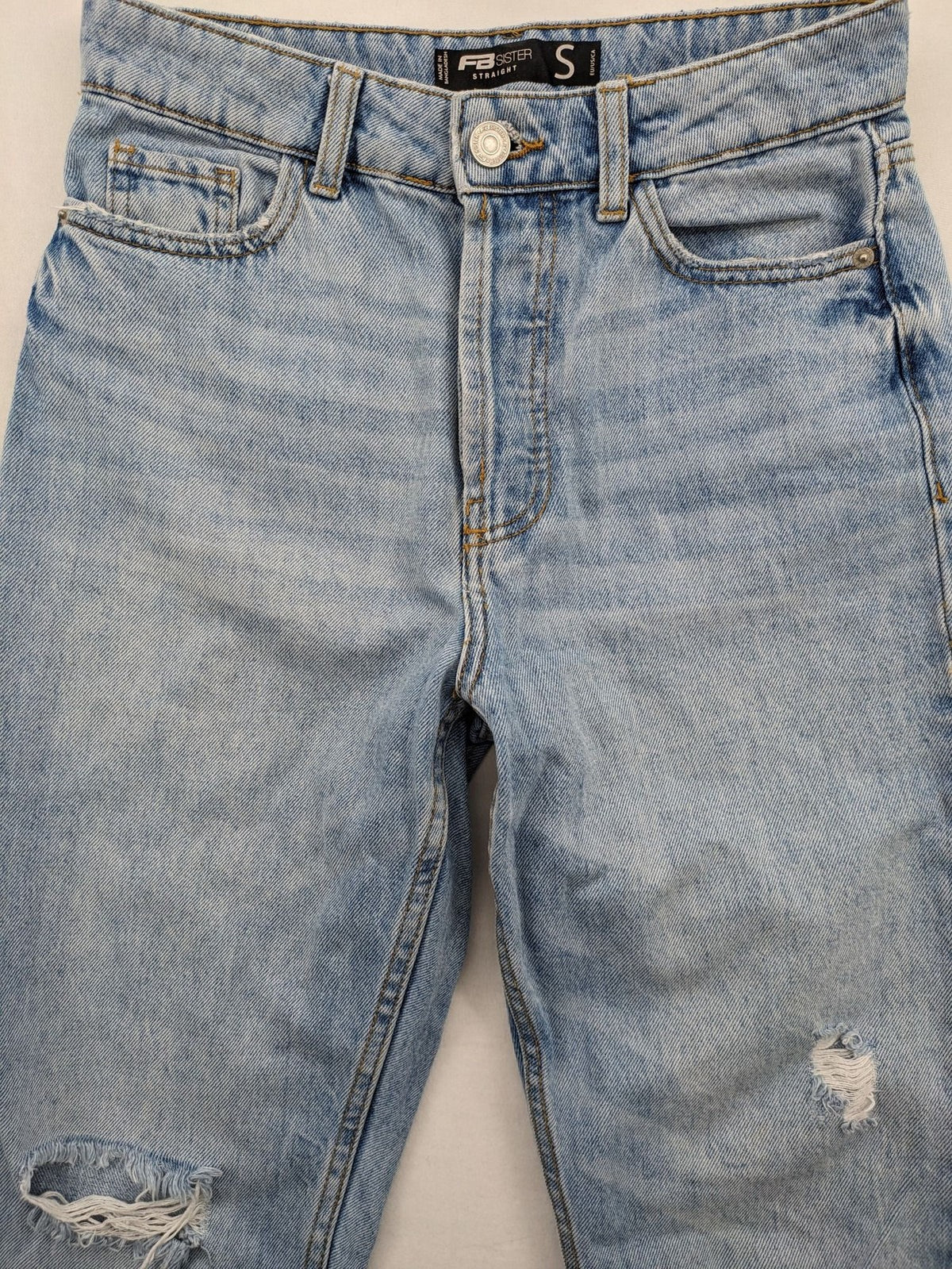 FB Sister blue straight leg jeans high rise with distressed detailing and button fly.