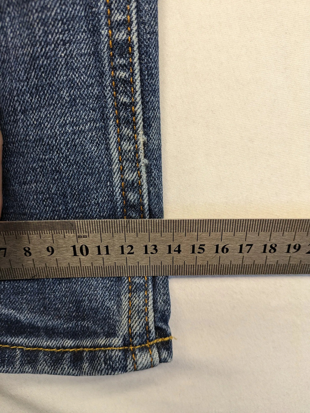 Hollister blue slim fit jeans with distressed detailing and classic button fly.