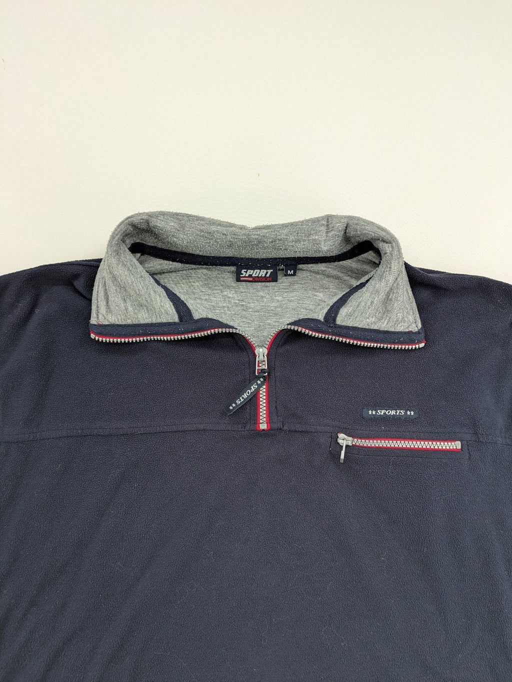 Sport Division turtle neck jumper dark blue fleece with quarter zip and chest pocket.