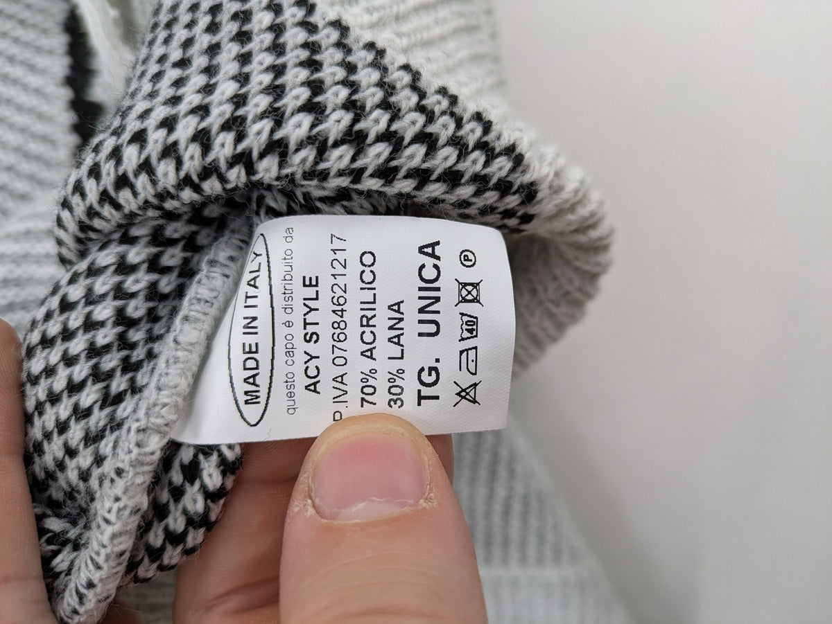 Drizzle turtle neck jumper black grey with abstract graphic print and distressed details.
