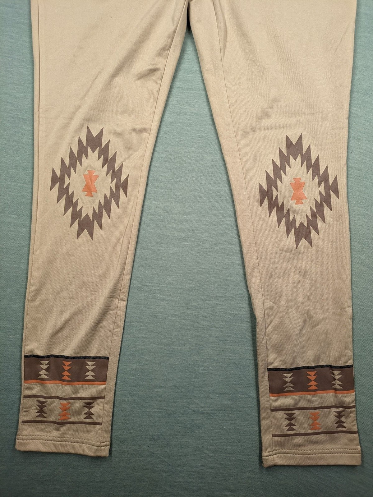 bpc bonprix collection beige leggings with colorful Aztec pattern at knees and hem