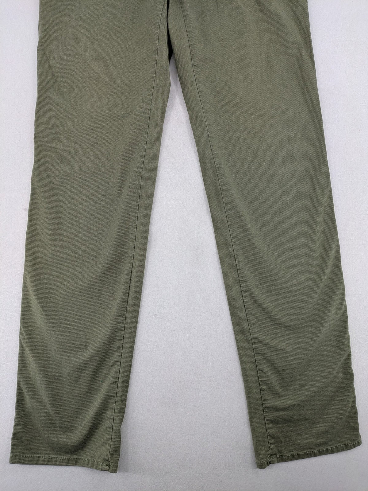BRAX green chino pants flat-front design with zipper and buttoned back pockets.