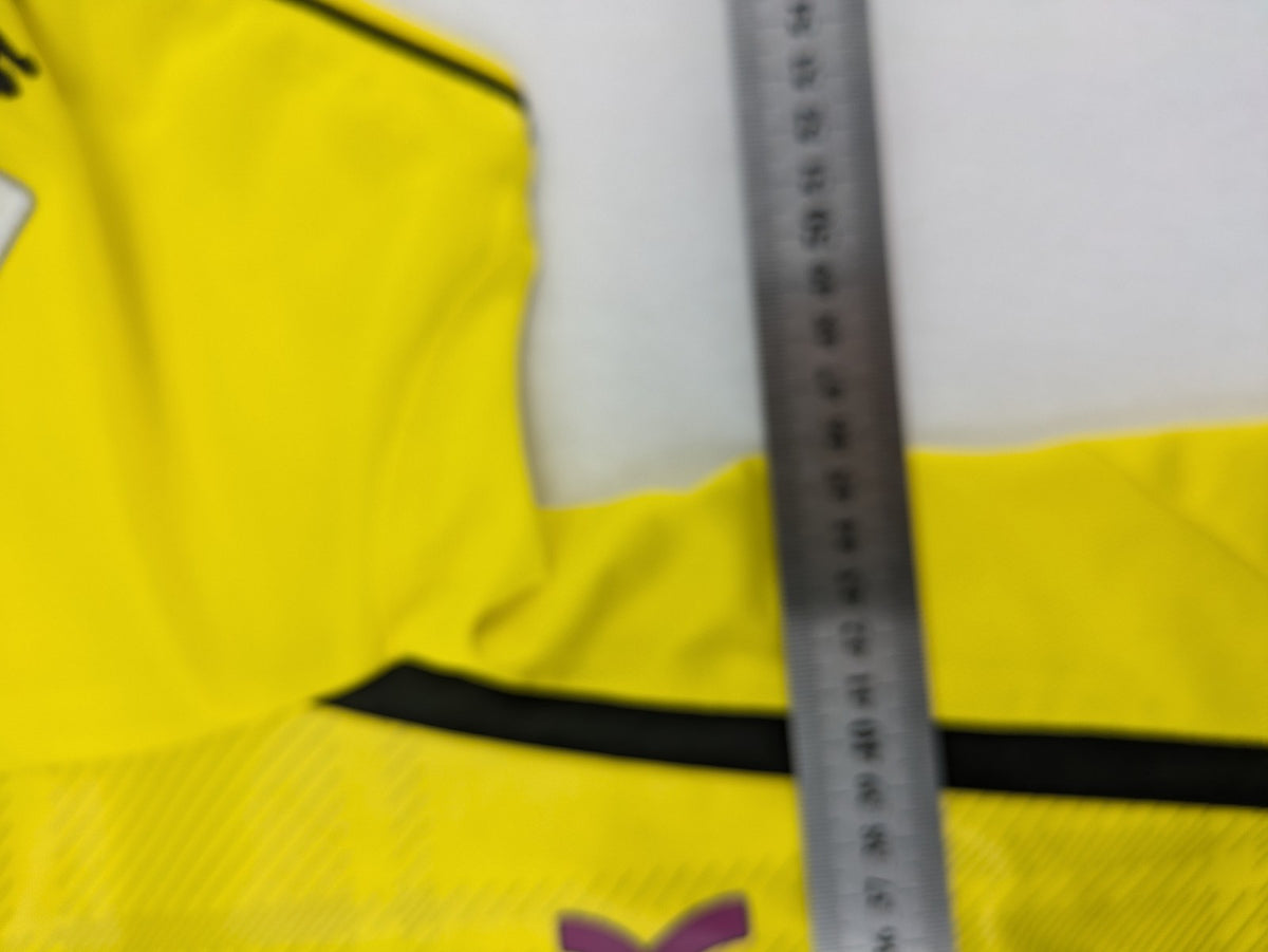 Borussia Dortmund black and yellow soccer uniform with DFB Pokal 2014 patch and Puma logo.