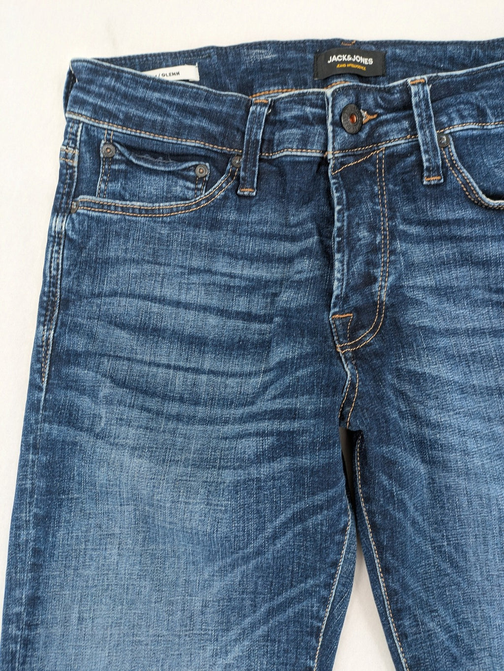 Jack & Jones blue slim fit jeans with faded wash and classic button fly.
