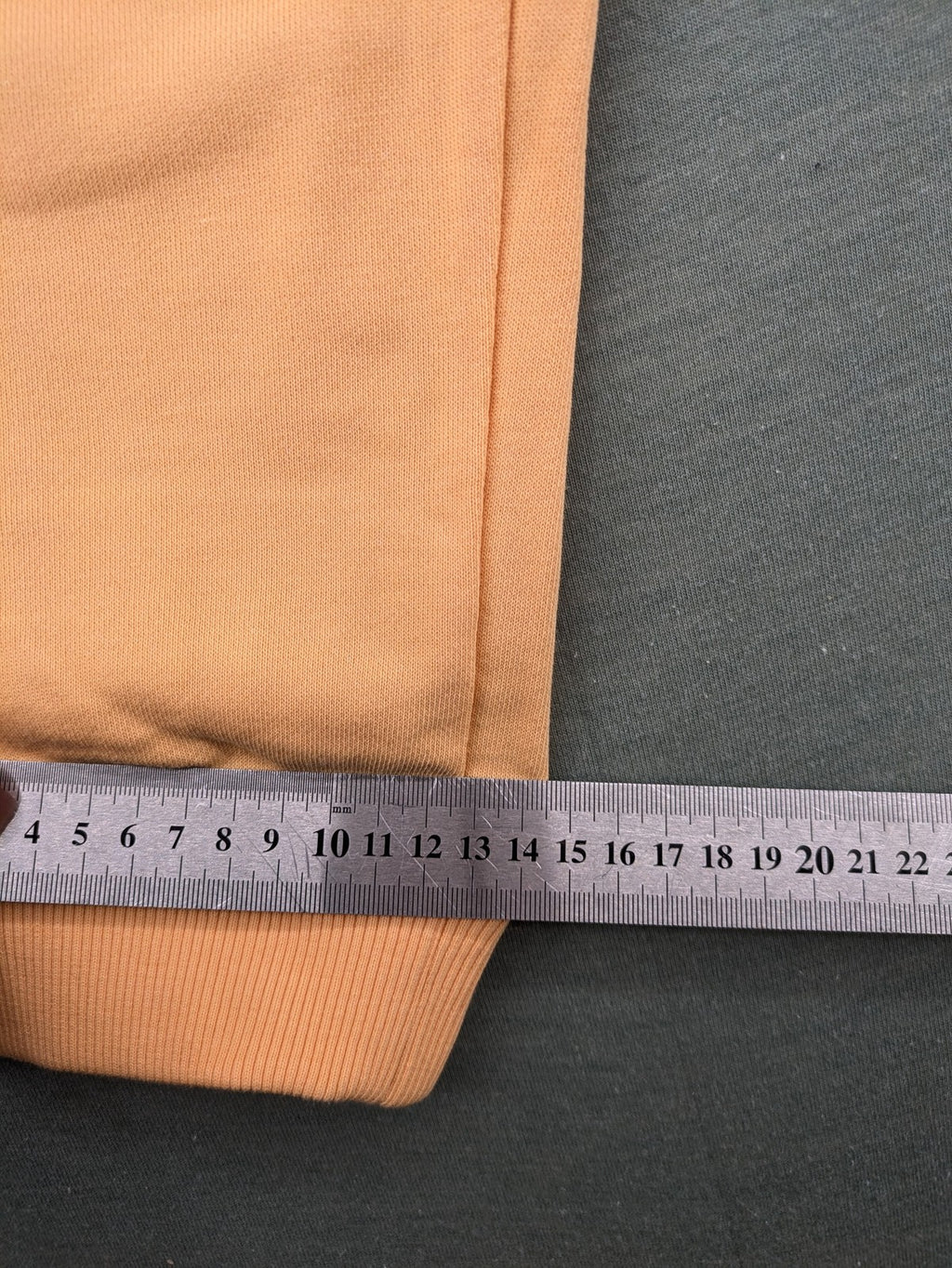 U.S. Polo Assn. orange sweatpants slim fit with sequin USPA logo on leg.