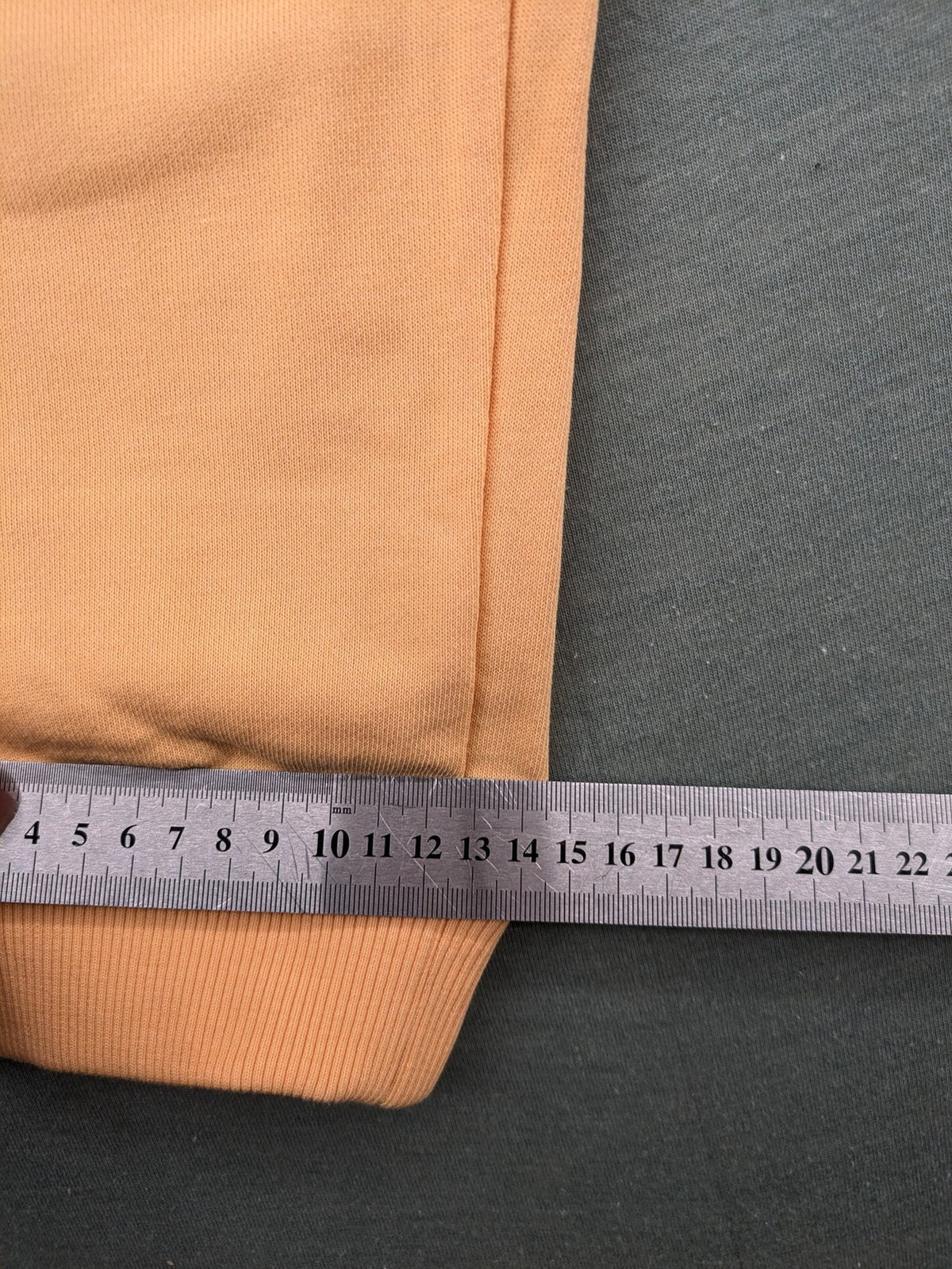 U.S. Polo Assn. orange sweatpants slim fit with sequin USPA logo on leg.