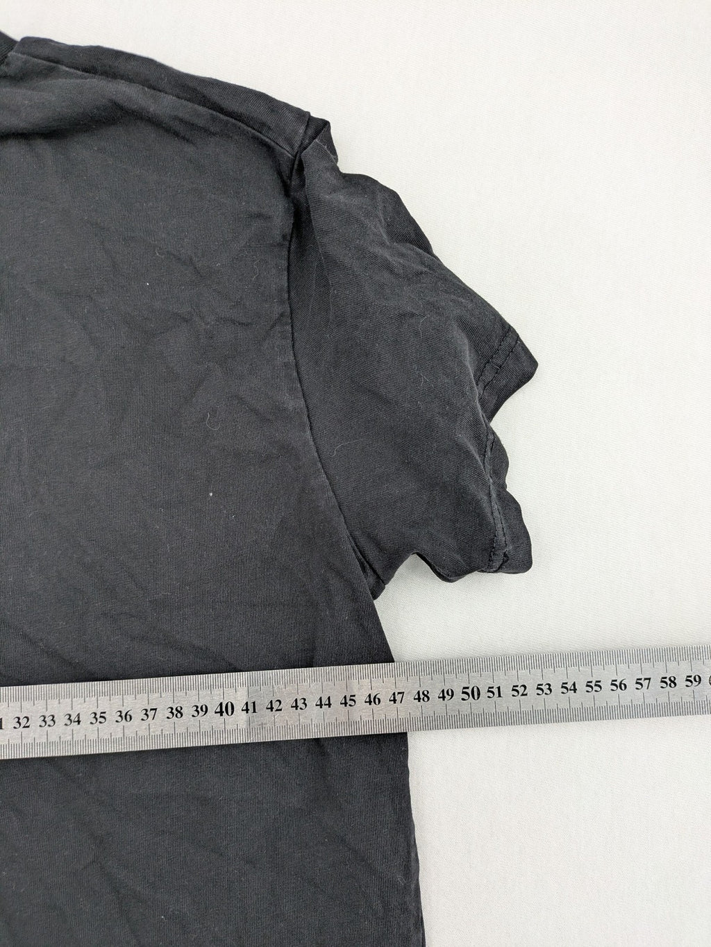 Dsquared2 grey short sleeve shirt with red maple leaf and smiley face graphic.