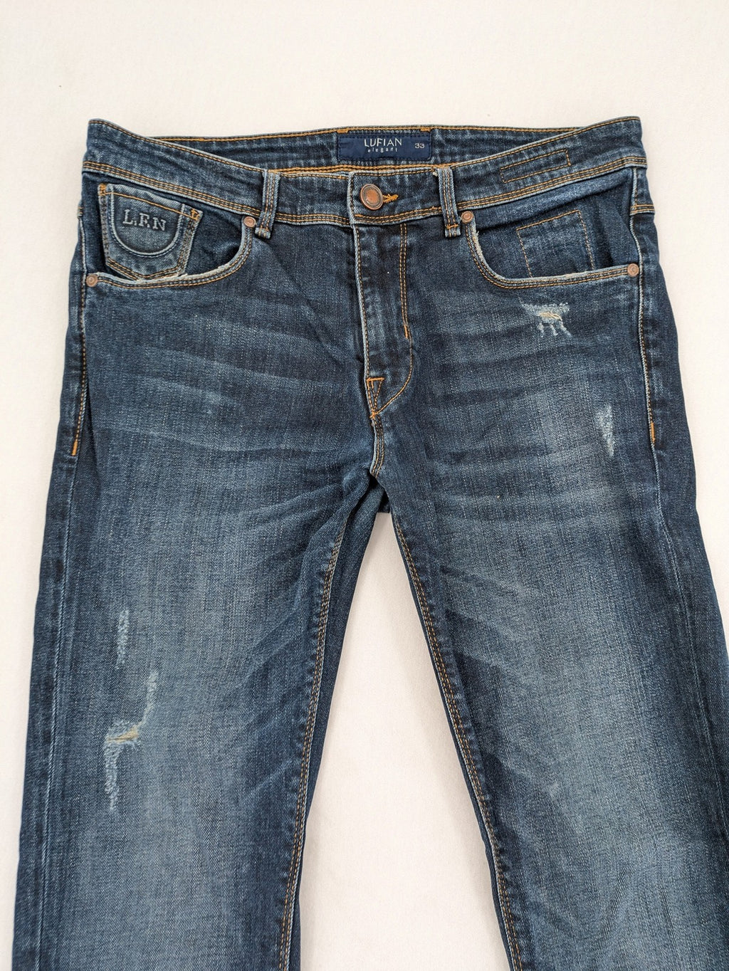 Lufian blue straight jeans dark wash distressed 5-pocket style with stretch denim.